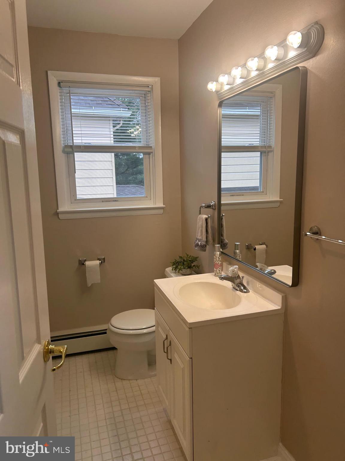 300 Evesham Avenue West Magnolia, NJ 08049 - Photo 17 of 25 a bathroom with a sink toilet and mirror