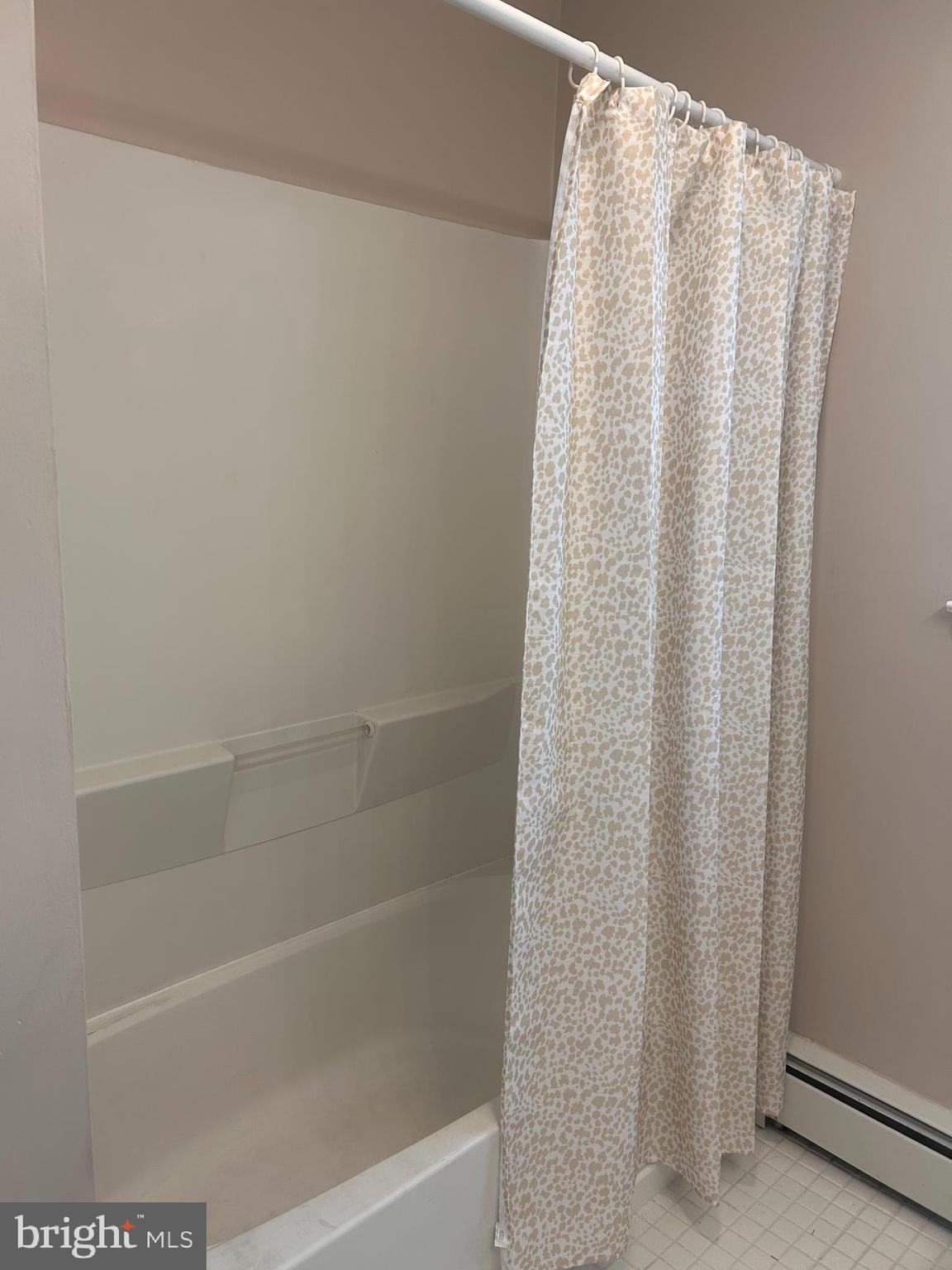 300 Evesham Avenue West Magnolia, NJ 08049 - Photo 19 of 25 a close up of a bathtub with shower