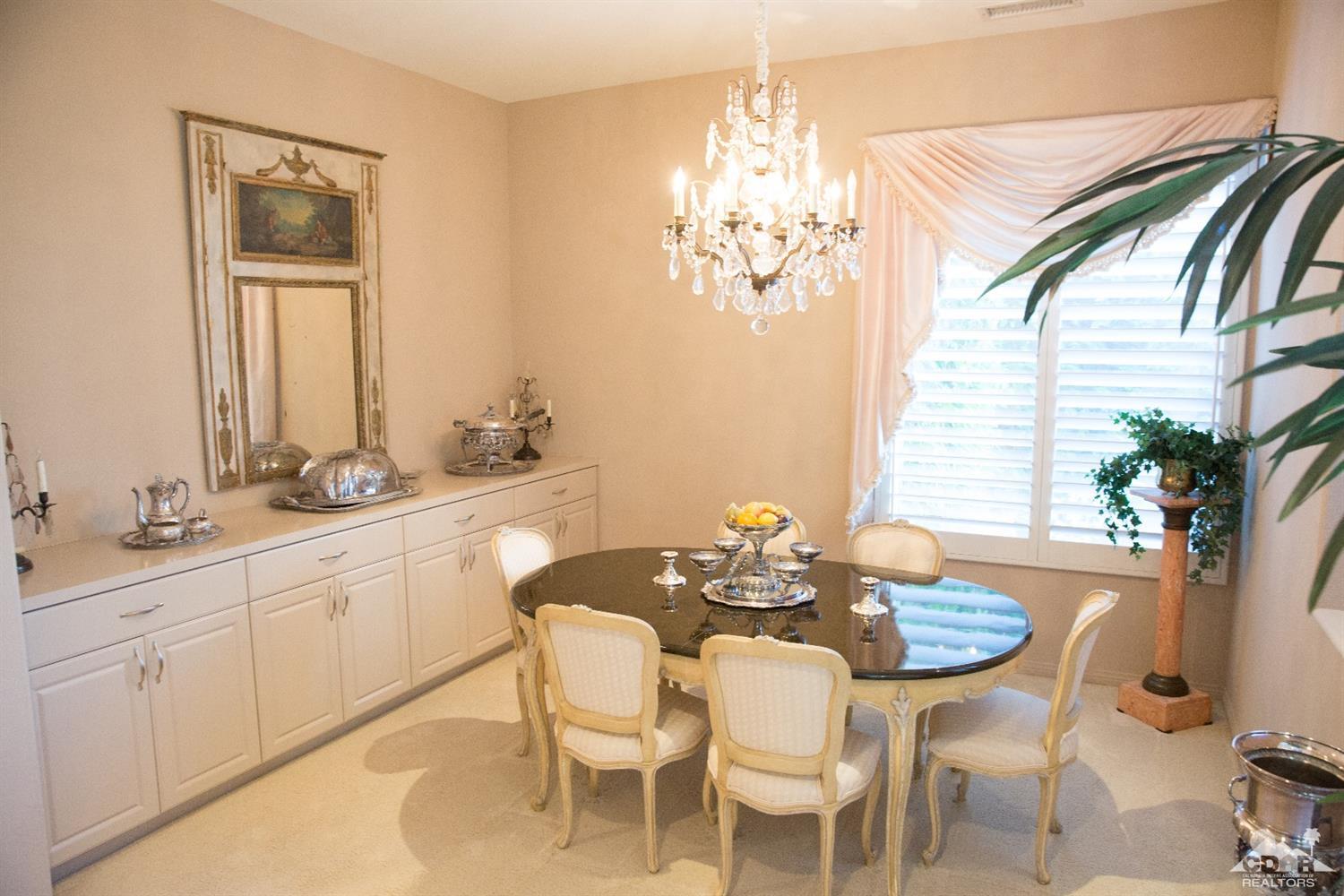 7 Sherwood Road Rancho Mirage, CA 92270 - Photo 13 of 35 a view of a dining room with furniture and chandelier