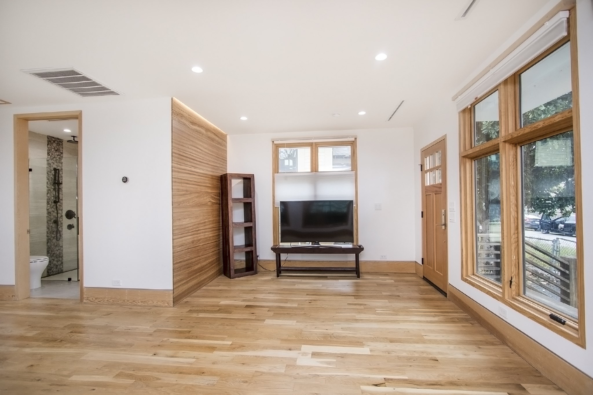 811 East 23rd Street Houston, TX 77009 - Photo 19 of 30 a view of a livingroom with wooden floor and a flat screen tv