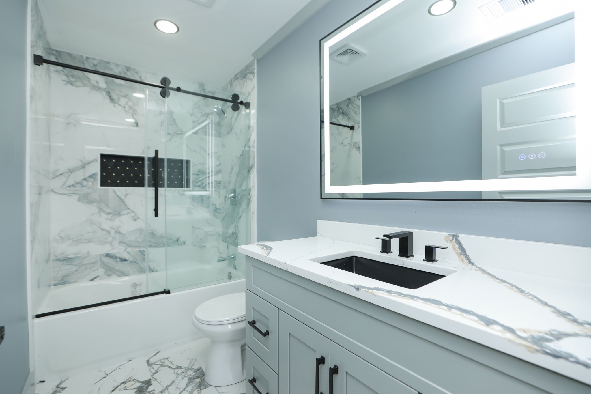 4047 Juliet Street Houston, TX 77087 - Photo 29 of 38 a bathroom with a sink a toilet and shower