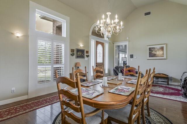 103 Ridgeway Gap Ovilla, TX 75154 - Photo 13 of 40 a dining room with furniture a chandelier and window