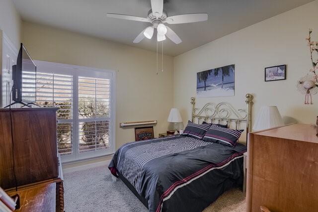 103 Ridgeway Gap Ovilla, TX 75154 - Photo 14 of 40 a bedroom with a bed dresser and a window