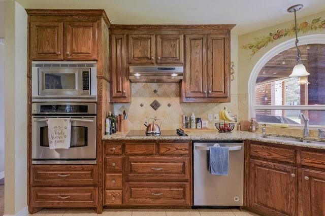 103 Ridgeway Gap Ovilla, TX 75154 - Photo 17 of 40 a kitchen with granite countertop stainless steel appliances and cabinets