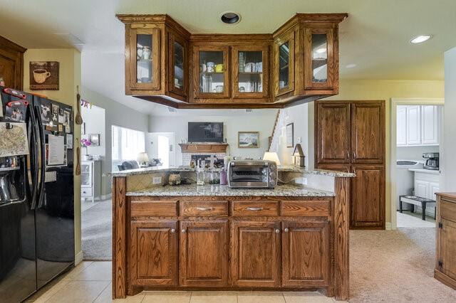 103 Ridgeway Gap Ovilla, TX 75154 - Photo 19 of 40 a kitchen with stainless steel appliances granite countertop a refrigerator and a stove top oven