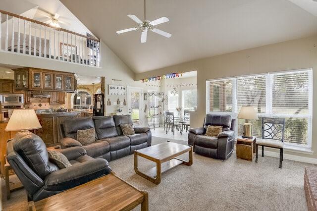 103 Ridgeway Gap Ovilla, TX 75154 - Photo 24 of 40 a living room with furniture ceiling fan and a floor to ceiling window