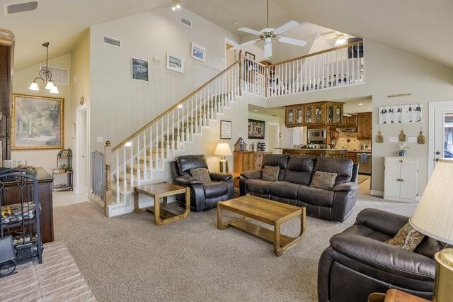 103 Ridgeway Gap Ovilla, TX 75154 - Photo 25 of 40 a living room with furniture or chandelier and a dining table