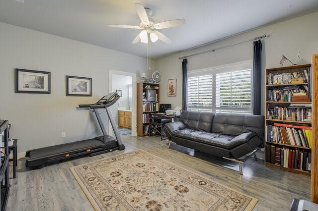103 Ridgeway Gap Ovilla, TX 75154 - Photo 26 of 40 a living room with furniture a window and a book shelf