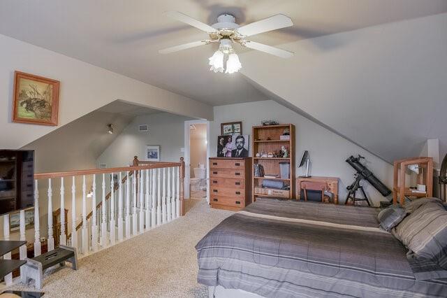 103 Ridgeway Gap Ovilla, TX 75154 - Photo 32 of 40 a bedroom with furniture and a chandelier