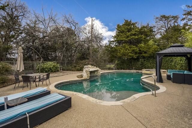 103 Ridgeway Gap Ovilla, TX 75154 - Photo 38 of 40 a view of a swimming pool with a patio