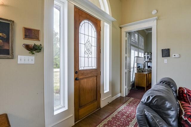 103 Ridgeway Gap Ovilla, TX 75154 - Photo 4 of 40 a bedroom with a bed and a mirror