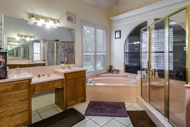 103 Ridgeway Gap Ovilla, TX 75154 - Photo 8 of 40 a bathroom with a tub sink and mirror