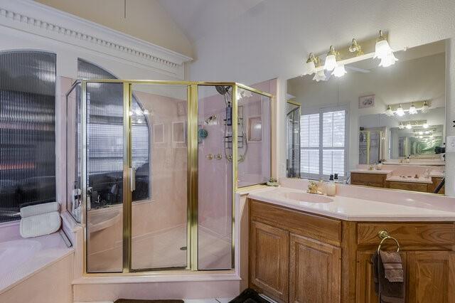 103 Ridgeway Gap Ovilla, TX 75154 - Photo 9 of 40 a bathroom with a sink a mirror and shower