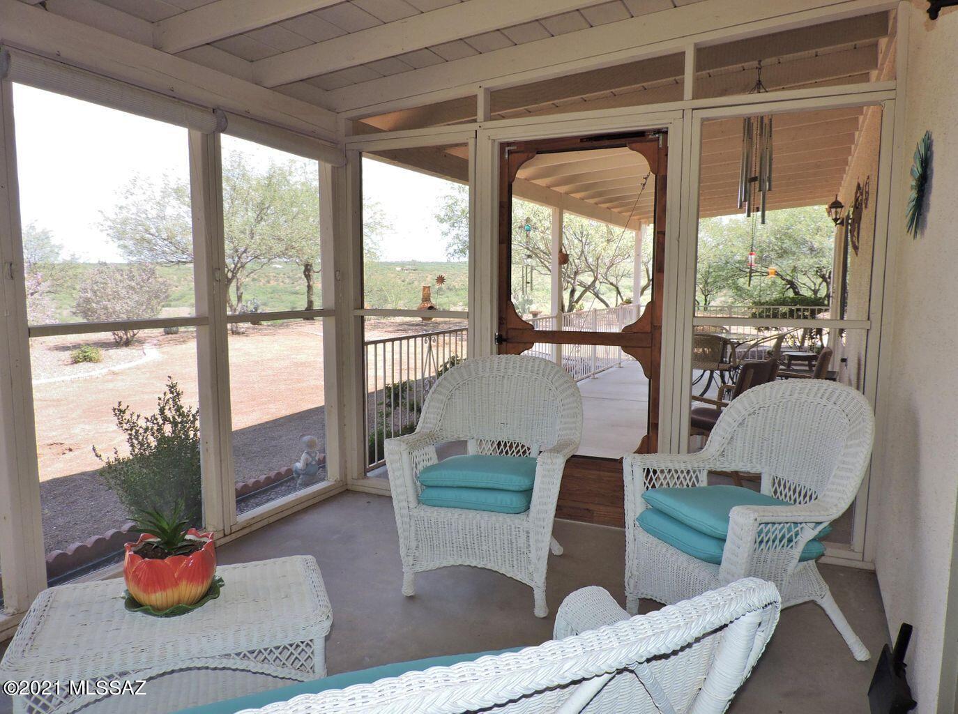1704 Leary Court Rio Rico, AZ 85648 - Photo 29 of 37 a living room with furniture and a potted plant