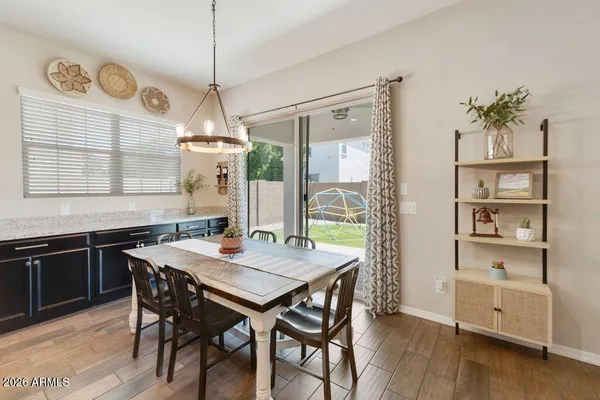 a view of a dining room with furniture window and wooden floor