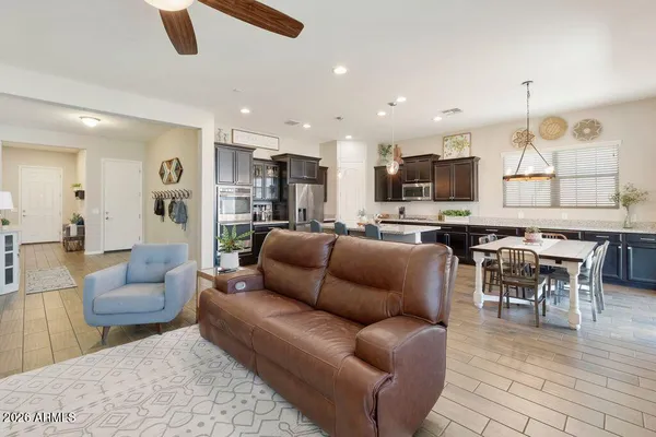 a living room kitchen with furniture and a view of kitchen