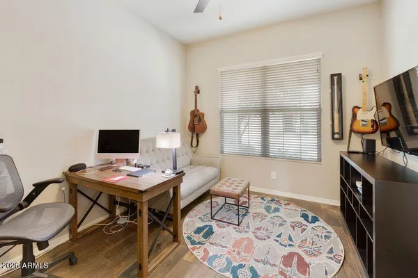 a workspace with furniture and a flat screen tv