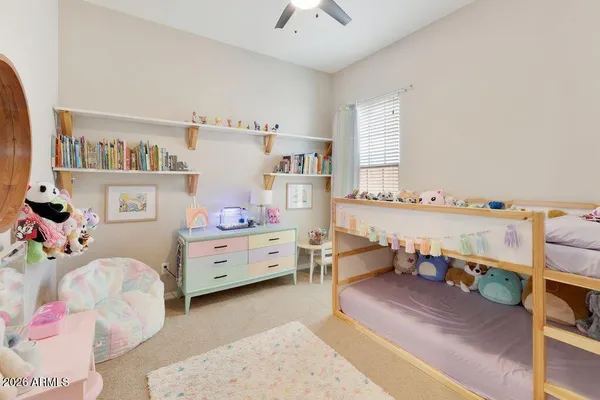 a bed room with a bed and a window