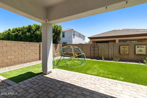 a view of a backyard with a garden and plants