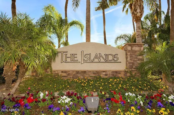 a view of sign board with flower around