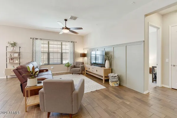 a living room with furniture and a large window