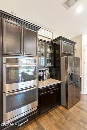 a kitchen with kitchen island granite countertop stainless steel appliances and counter space
