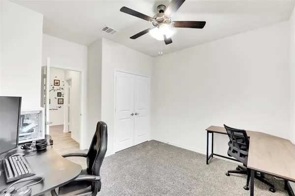 a view of a workspace with furniture