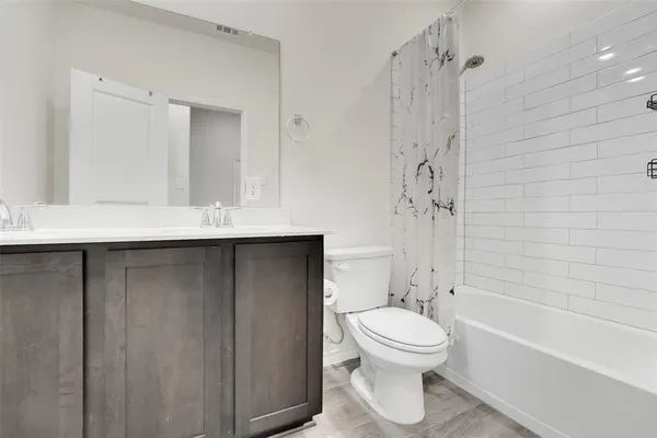 a bathroom with a toilet a sink and a bathtub