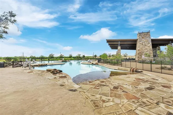 a view of swimming pool with outdoor seating