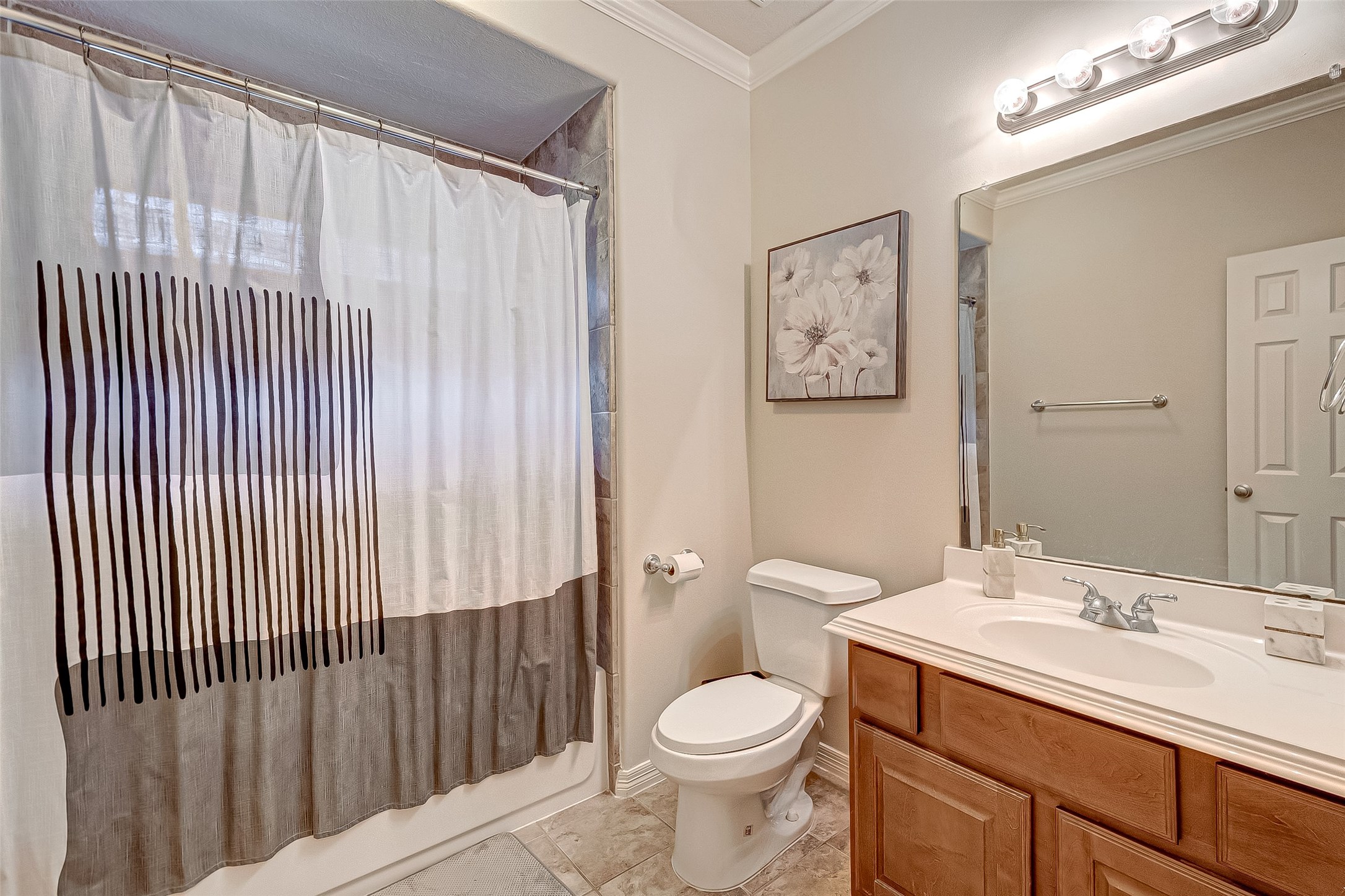 14418 Basalt Lane Houston, TX 77077 - Photo 15 of 32 a bathroom with a toilet a sink and a mirror