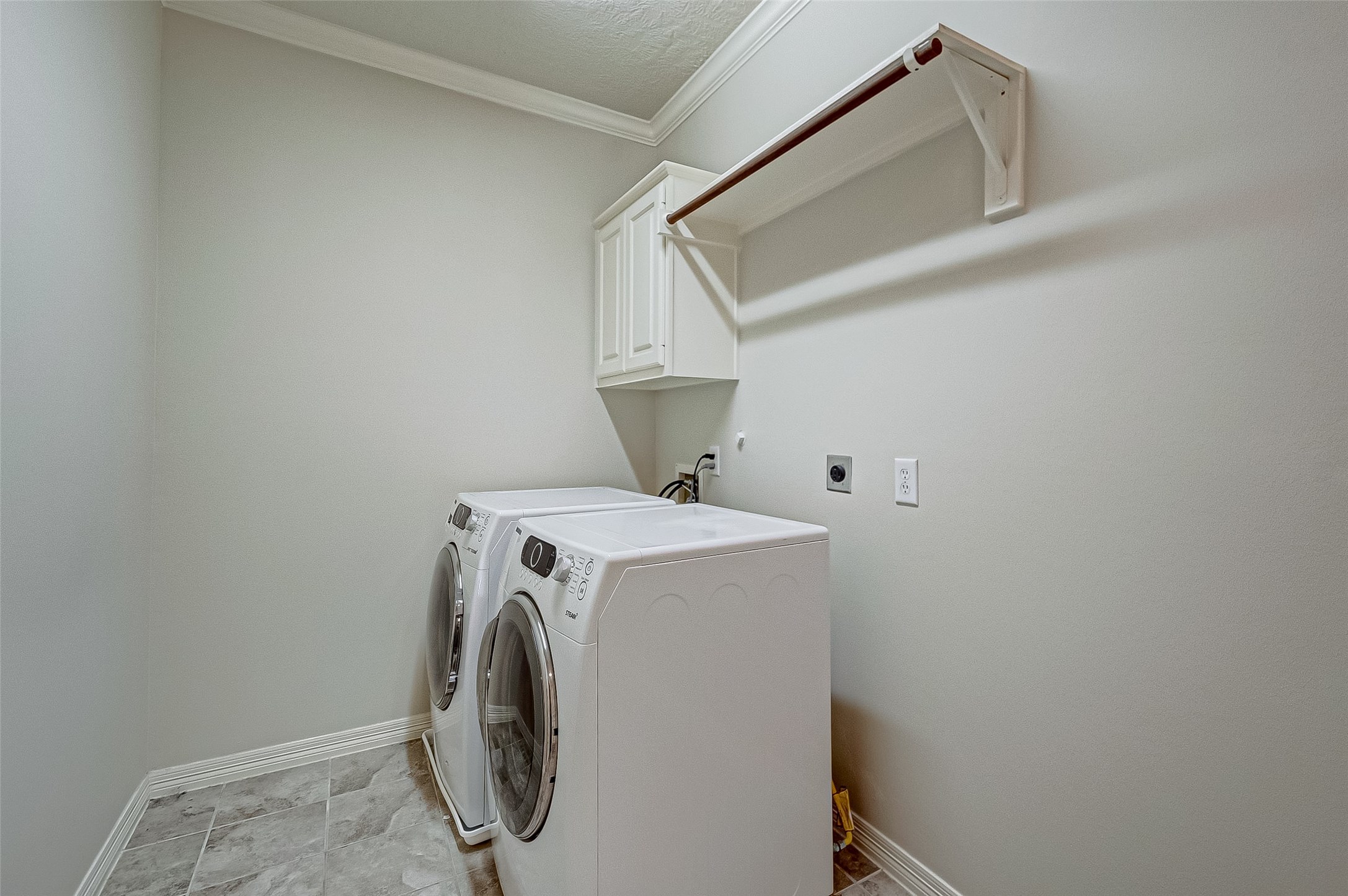 14418 Basalt Lane Houston, TX 77077 - Photo 16 of 32 a utility room with dryer and washer