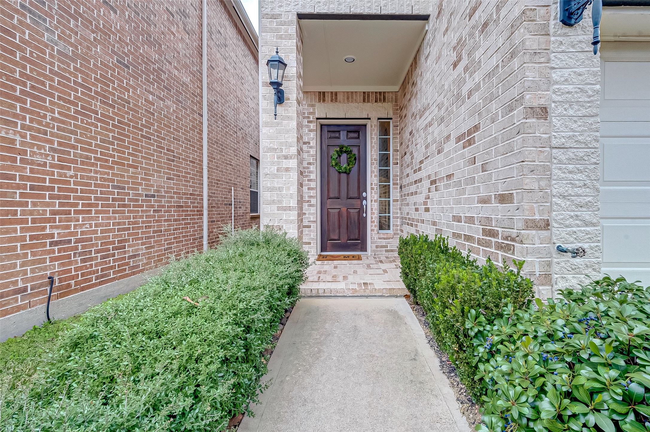 14418 Basalt Lane Houston, TX 77077 - Photo 2 of 32 a front view of a house with a garden
