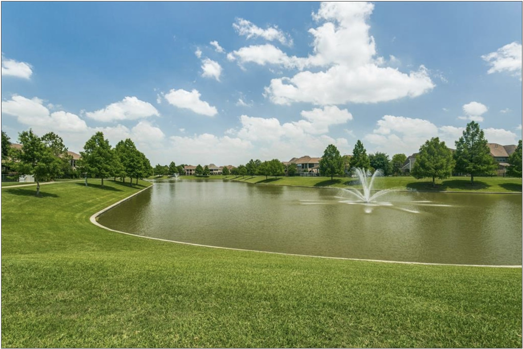 14418 Basalt Lane Houston, TX 77077 - Photo 32 of 32 a view of a lake with houses in the back