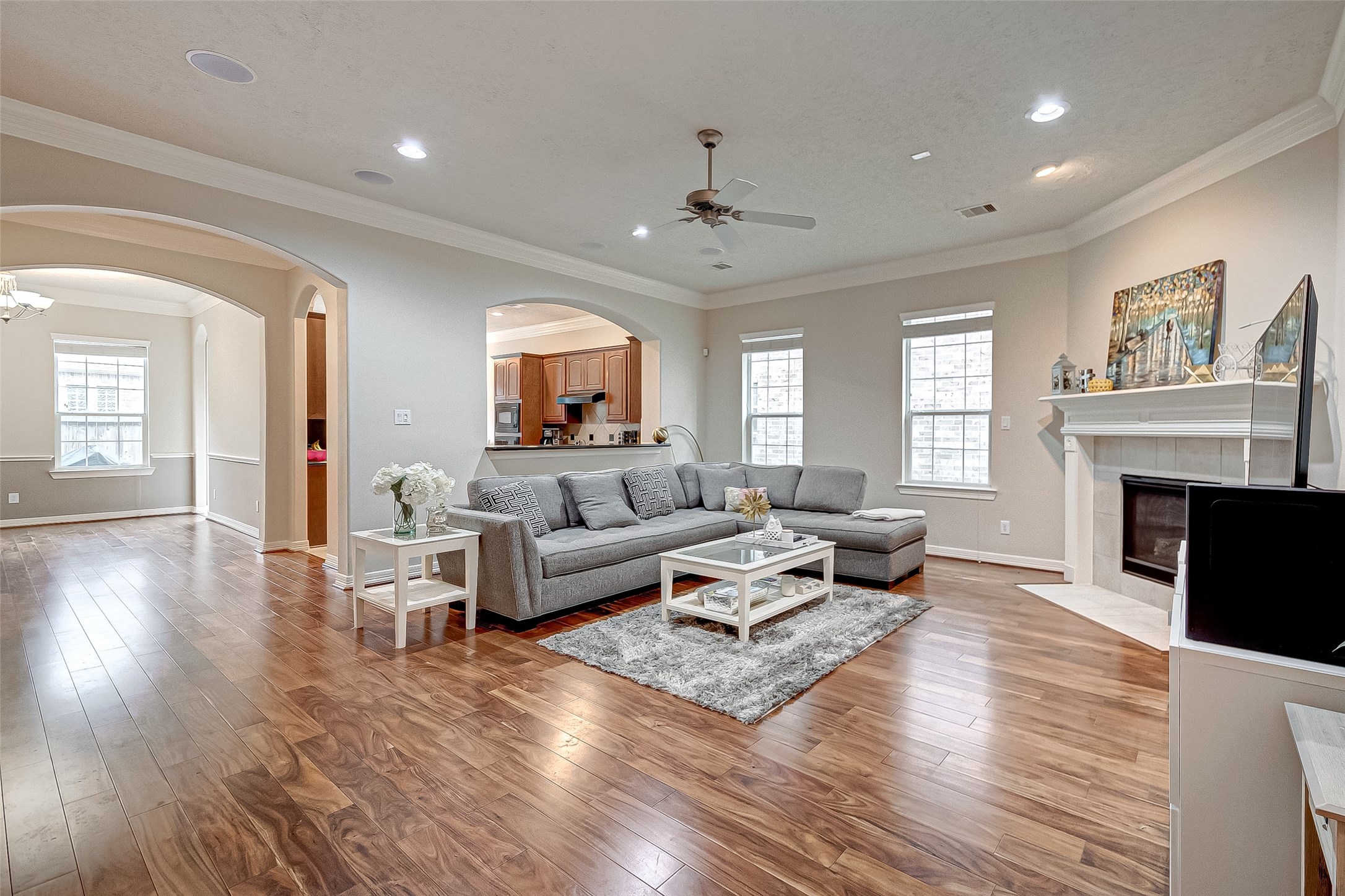 14418 Basalt Lane Houston, TX 77077 - Photo 5 of 32 a living room with fireplace furniture and a wooden floor