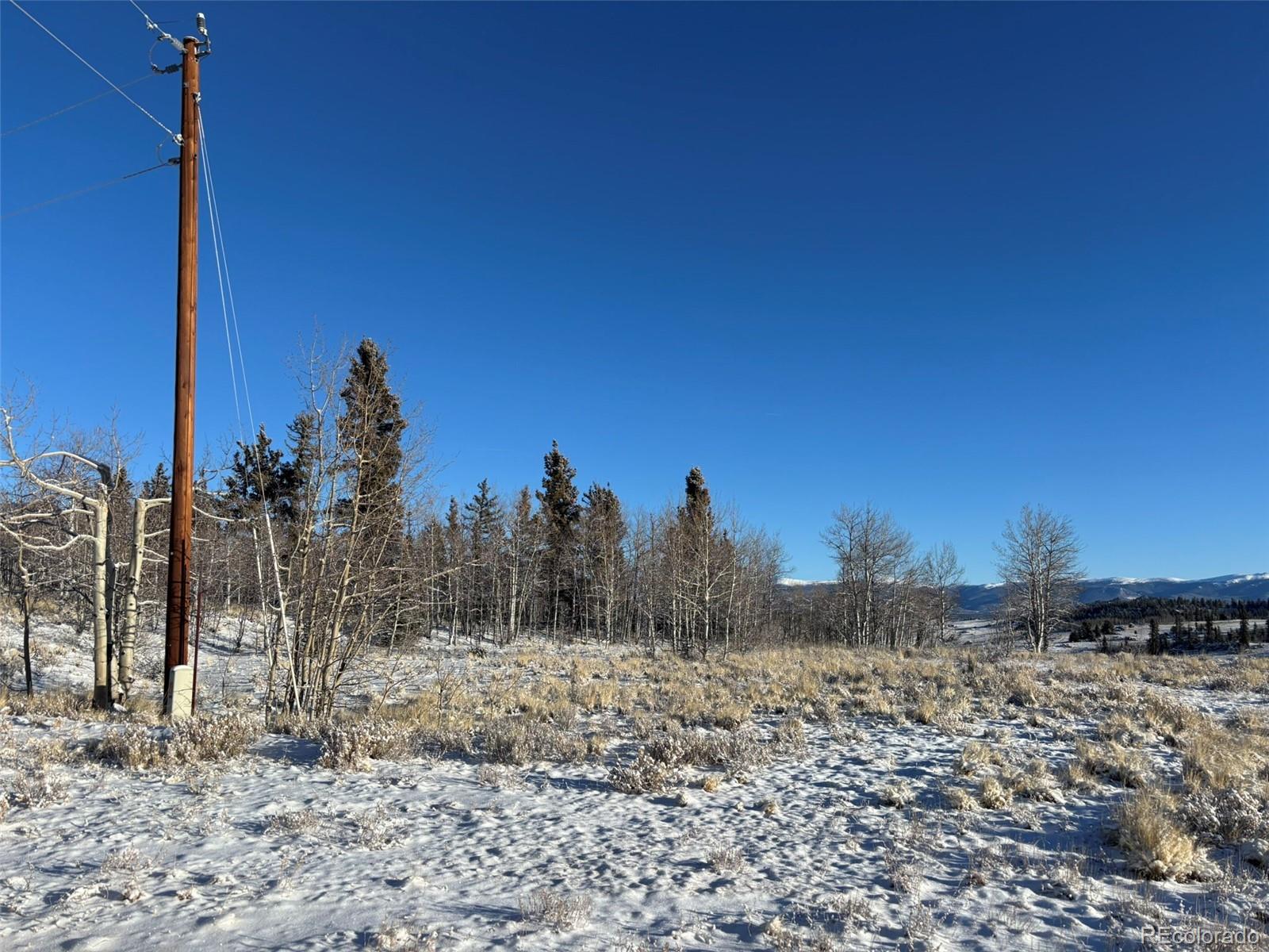 769 Mockingbird Circle Como, CO 80432 - Photo 13 of 18 a view of a covered with snow on the ground