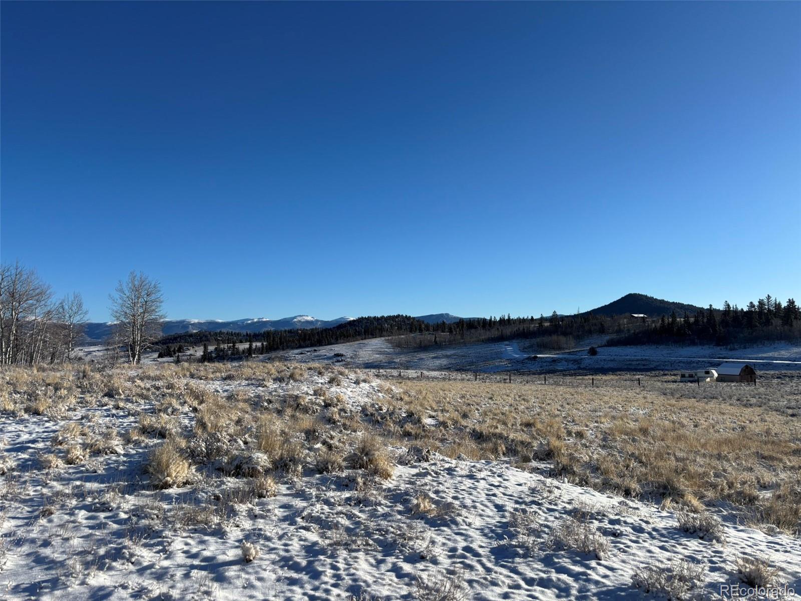 769 Mockingbird Circle Como, CO 80432 - Photo 15 of 18 a view of a lake with mountains in the background