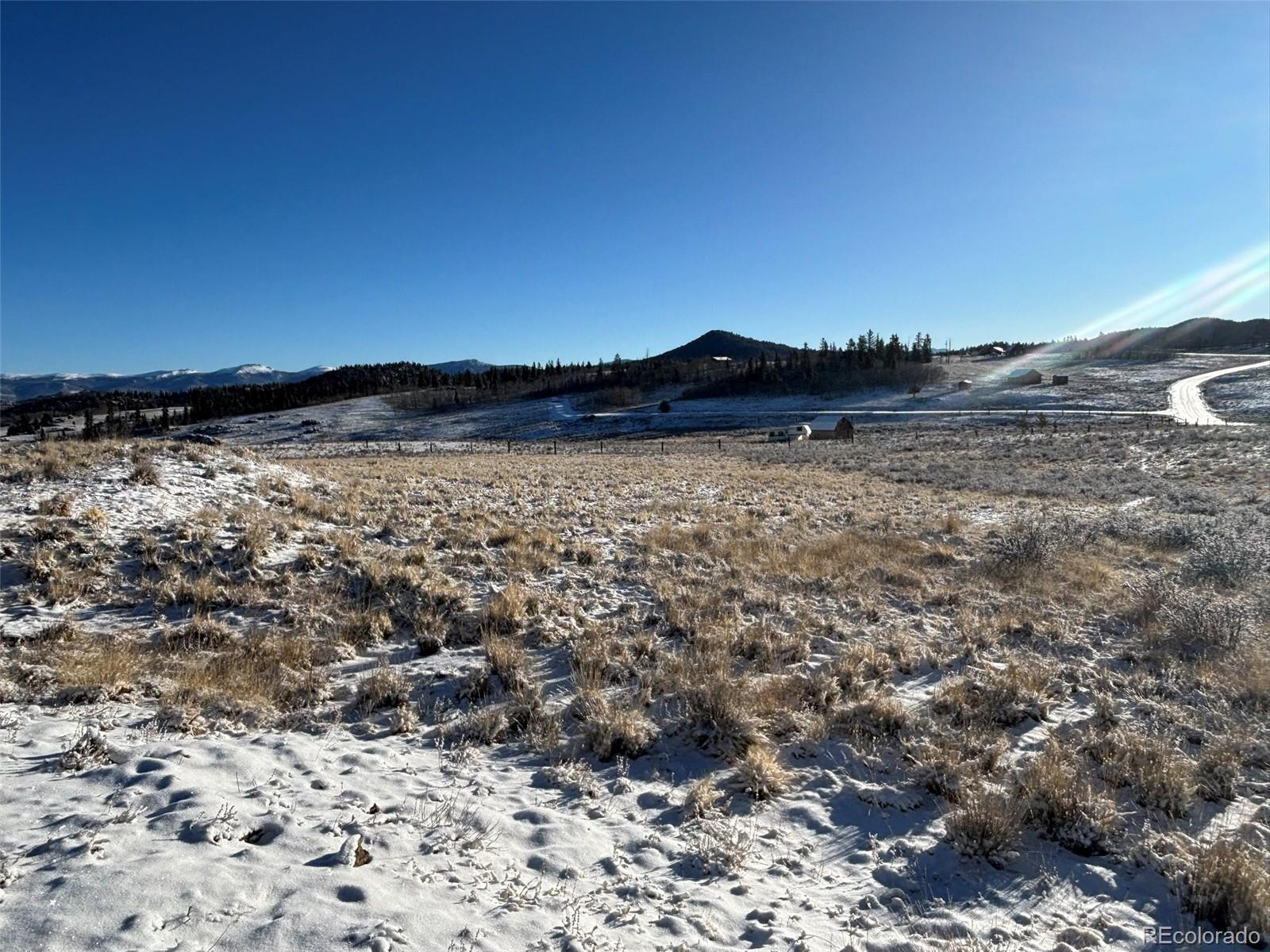 769 Mockingbird Circle Como, CO 80432 - Photo 16 of 18 a view of a large body of water with a building in the background