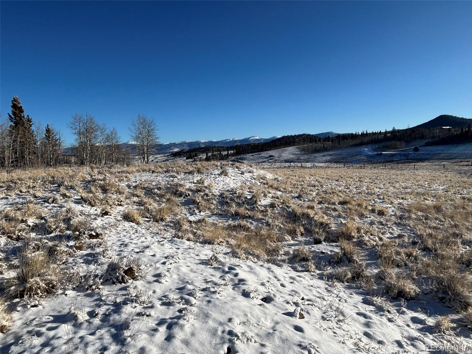 769 Mockingbird Circle Como, CO 80432 - Photo 17 of 18 a view of a large body of water with a building in the background