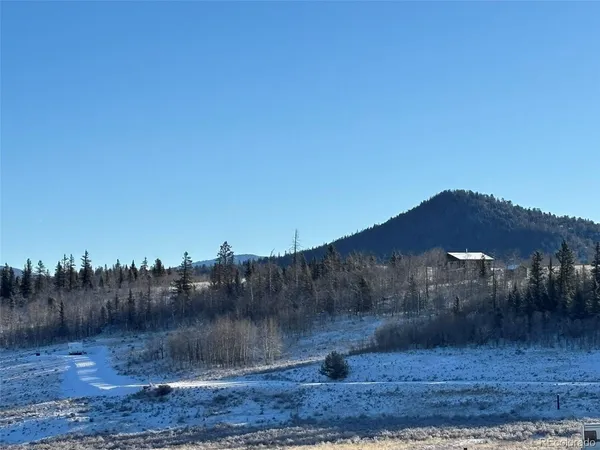a view of a snow in front of yard