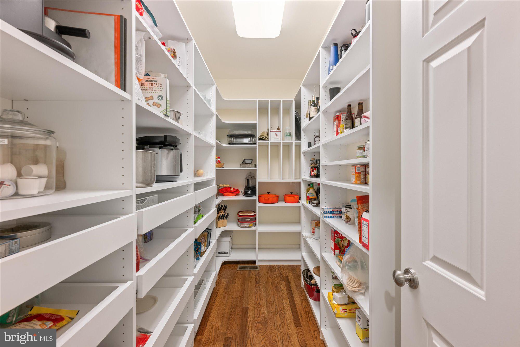 5608 Warwick Place Chevy Chase, MD 20815 - Photo 15 of 57 a view of staircase with lots of frames on wall