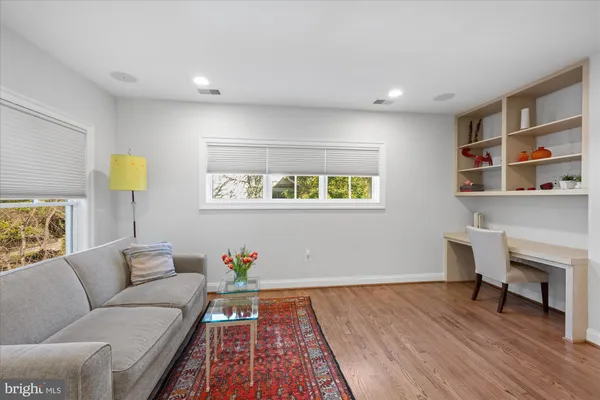 a spacious bedroom with a bed and a couch