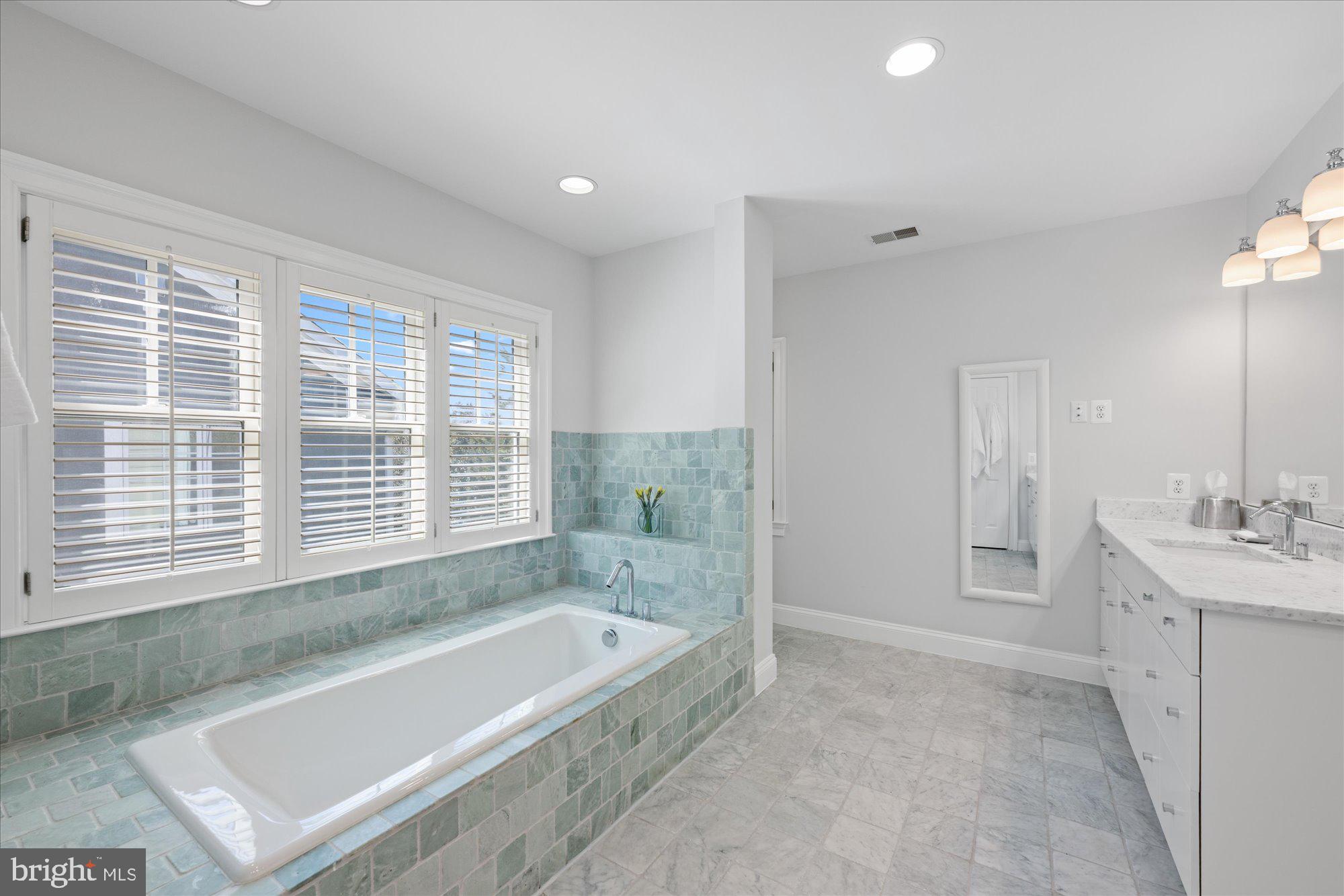 5608 Warwick Place Chevy Chase, MD 20815 - Photo 26 of 57 a bathroom with a bathtub and a sink
