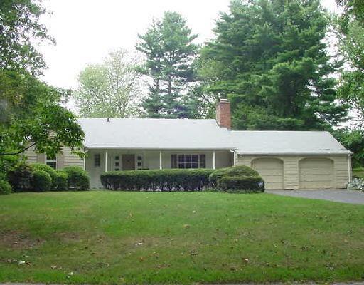 56 Stonybrook Road Fairfield, CT 06824 - Photo 1 of 1 a front view of house with yard and green space
