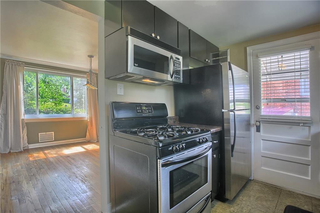 1906 Bower Hill Road Pittsburgh, PA 15243 - Photo 8 of 15 Updated kitchen leads to dining room or outdoors to covered porch.