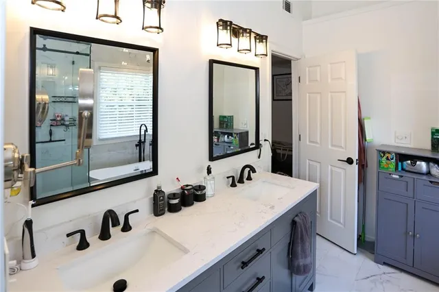 a living room with furniture and a dresser