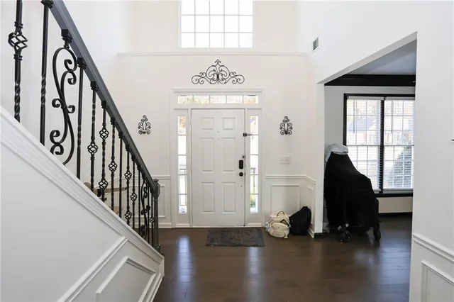 a view of an entryway with wooden floor