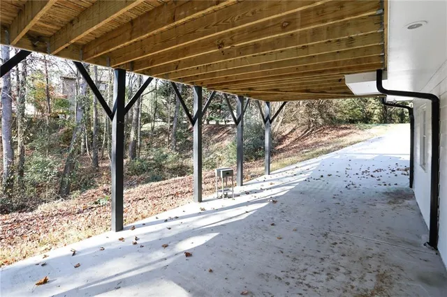 a view of staircase with a table and chairs