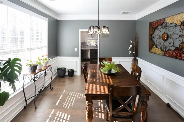 a kitchen with a refrigerator and a stove top oven