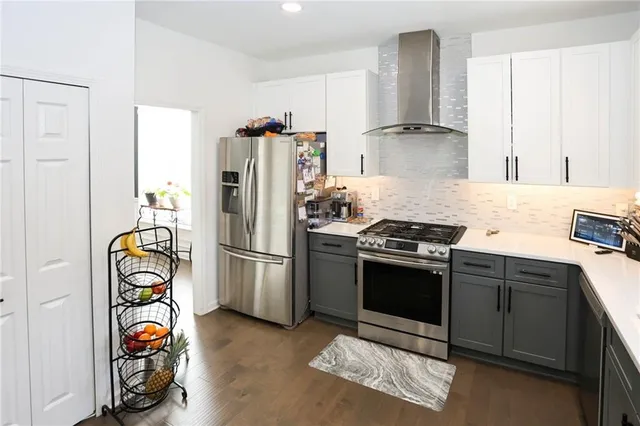 a kitchen with a sink stove and refrigerator