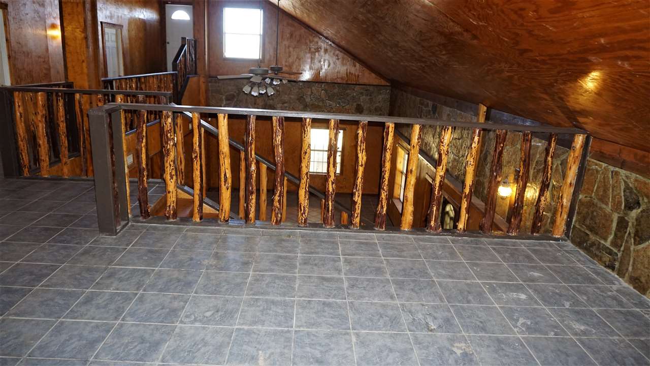 264 Los Huisaches Road Laredo, TX 78045 - Photo 12 of 13 a view of a porch with wooden floor and stairs